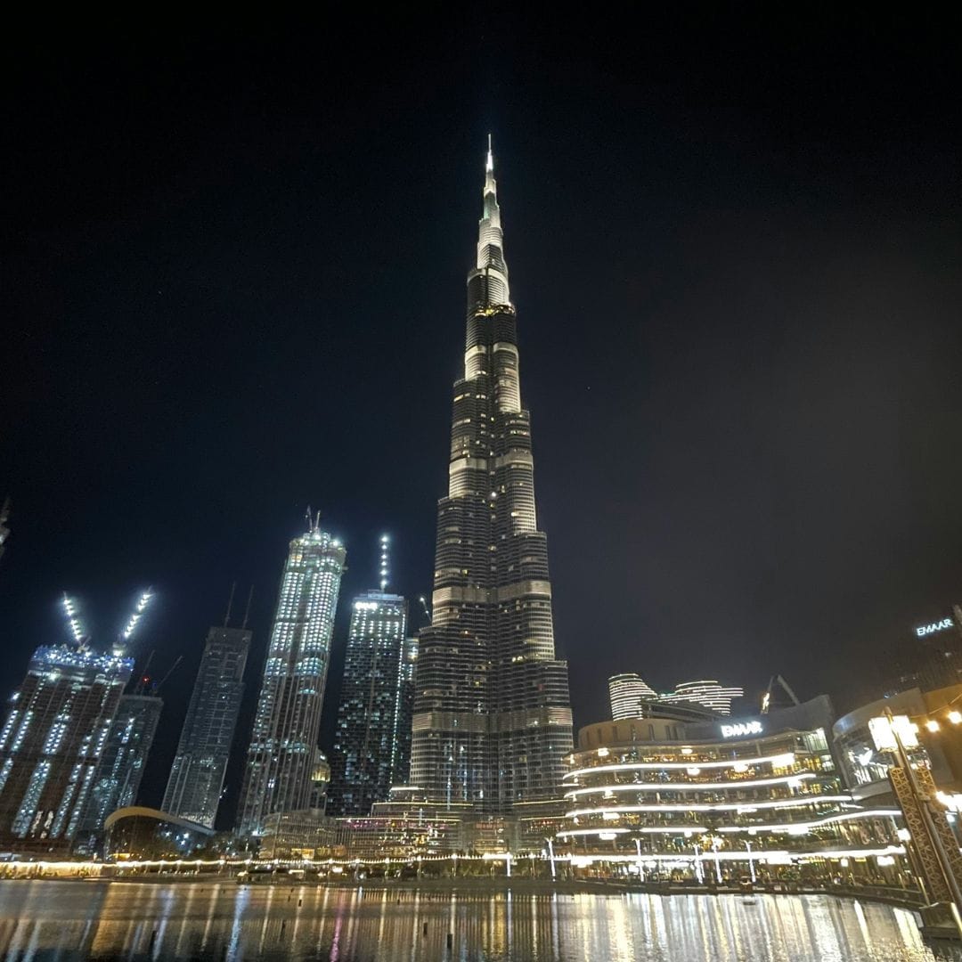 Burj Khalifa and Downtown Dubai skyline illuminated at night, representing Dubai family offices and private wealth hub
