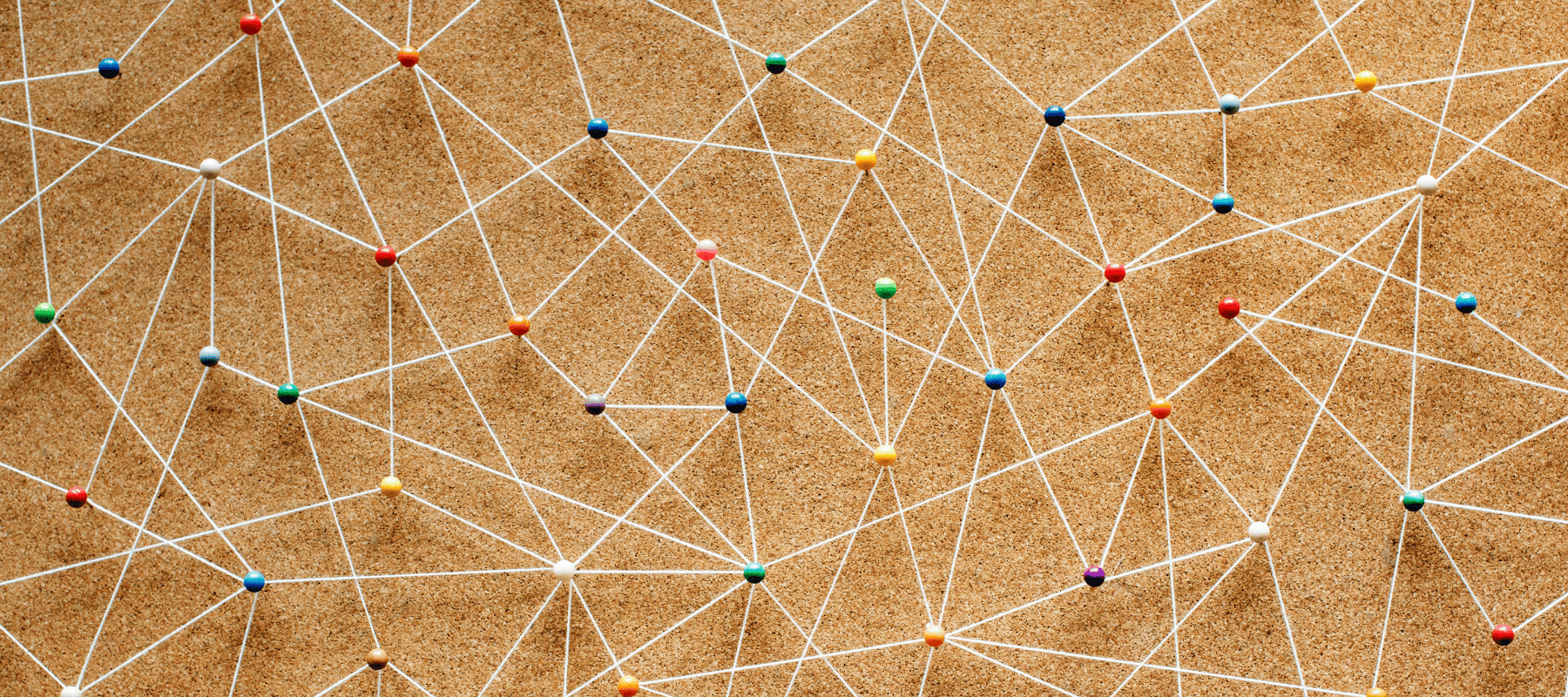 Network of coloured pins connected by white strings symbolising integration and automation in family office systems