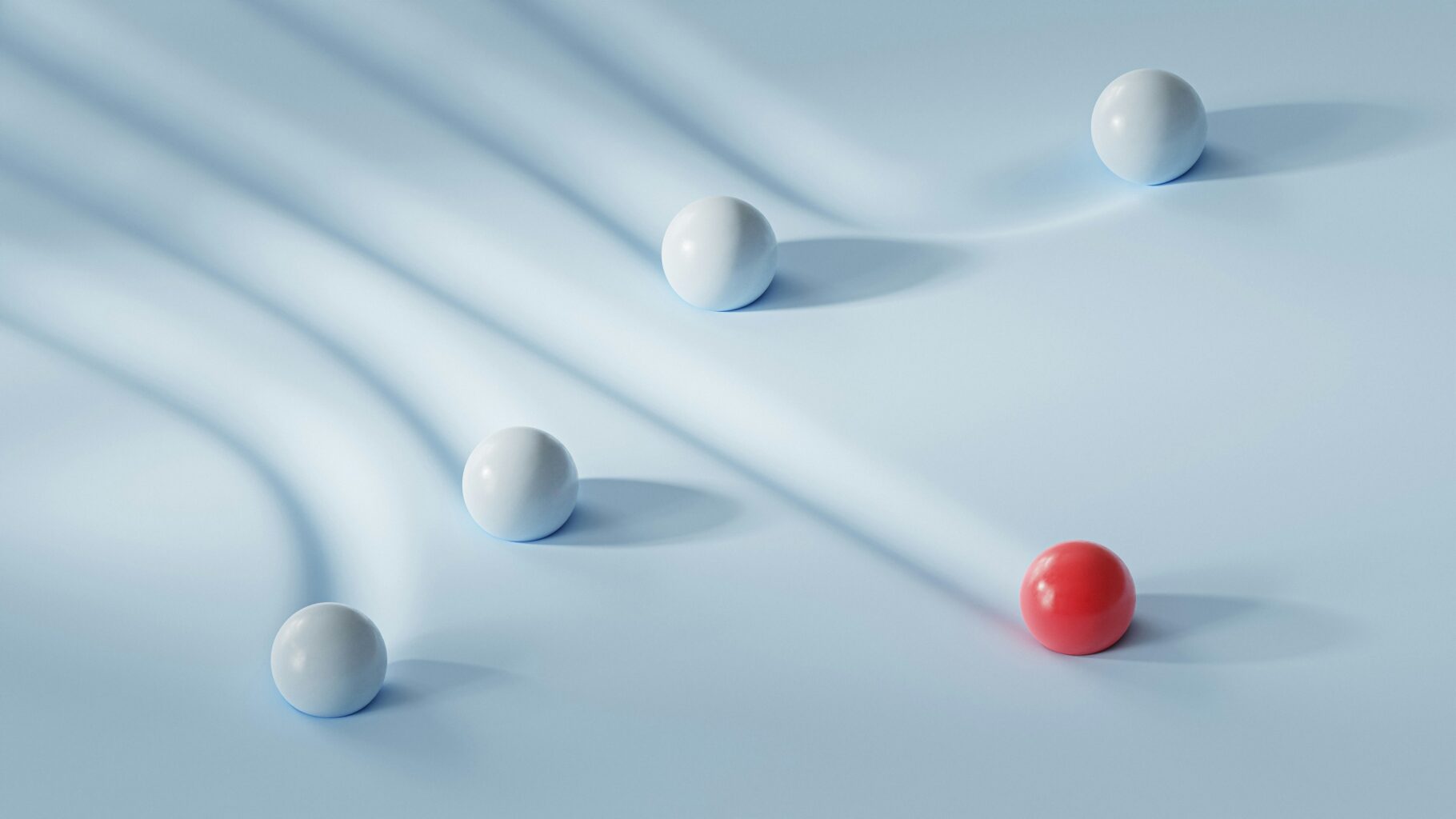3D art image of some balls rolling off long white tubes