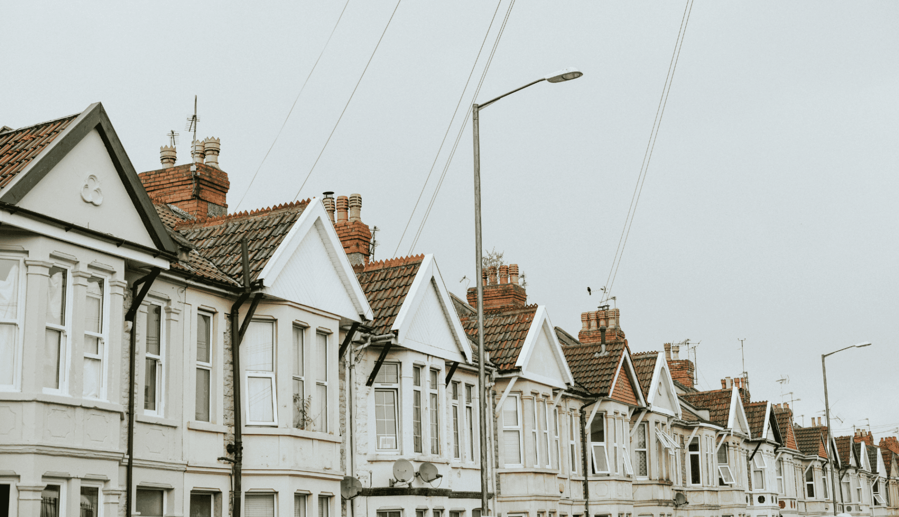 A row of traditional UK terraced houses representing multi-generational property inheritance and portfolio restructuring